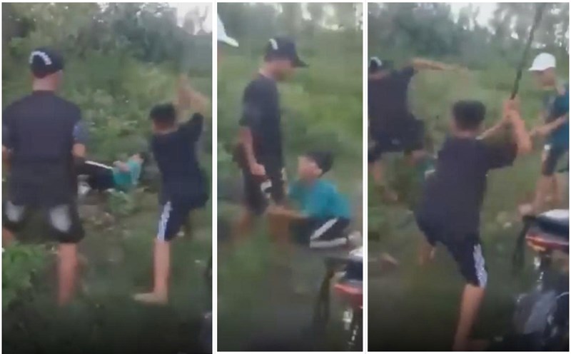 A male student in Binh Dinh was brutally beaten by a group of friends despite begging on his knees. Photo cut from a clip posted by Mr. N.H.V