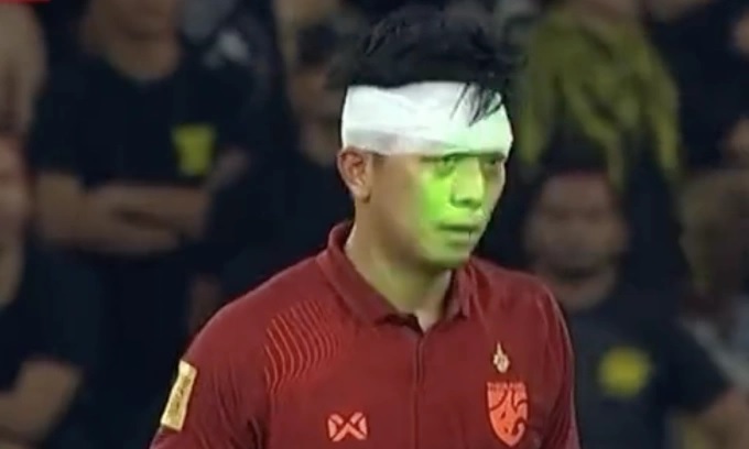 Malaysian fans often project laser into the faces of opposing players. Photo: Cut from video