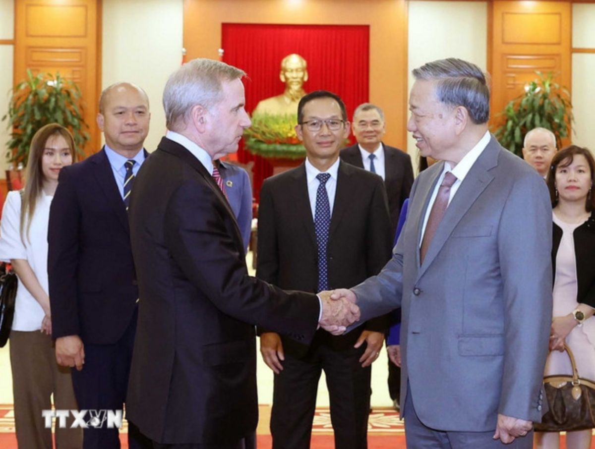 Tong Bi thu chuc mung thanh cong cua Qualcomm tai Viet Nam. Anh: TTXVN