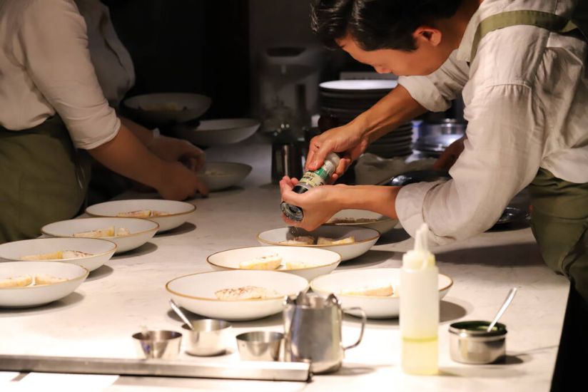 Inside the kitchen of a restaurant in Hanoi that has just been awarded a Michelin Green Star. Photo: Hieu Trung