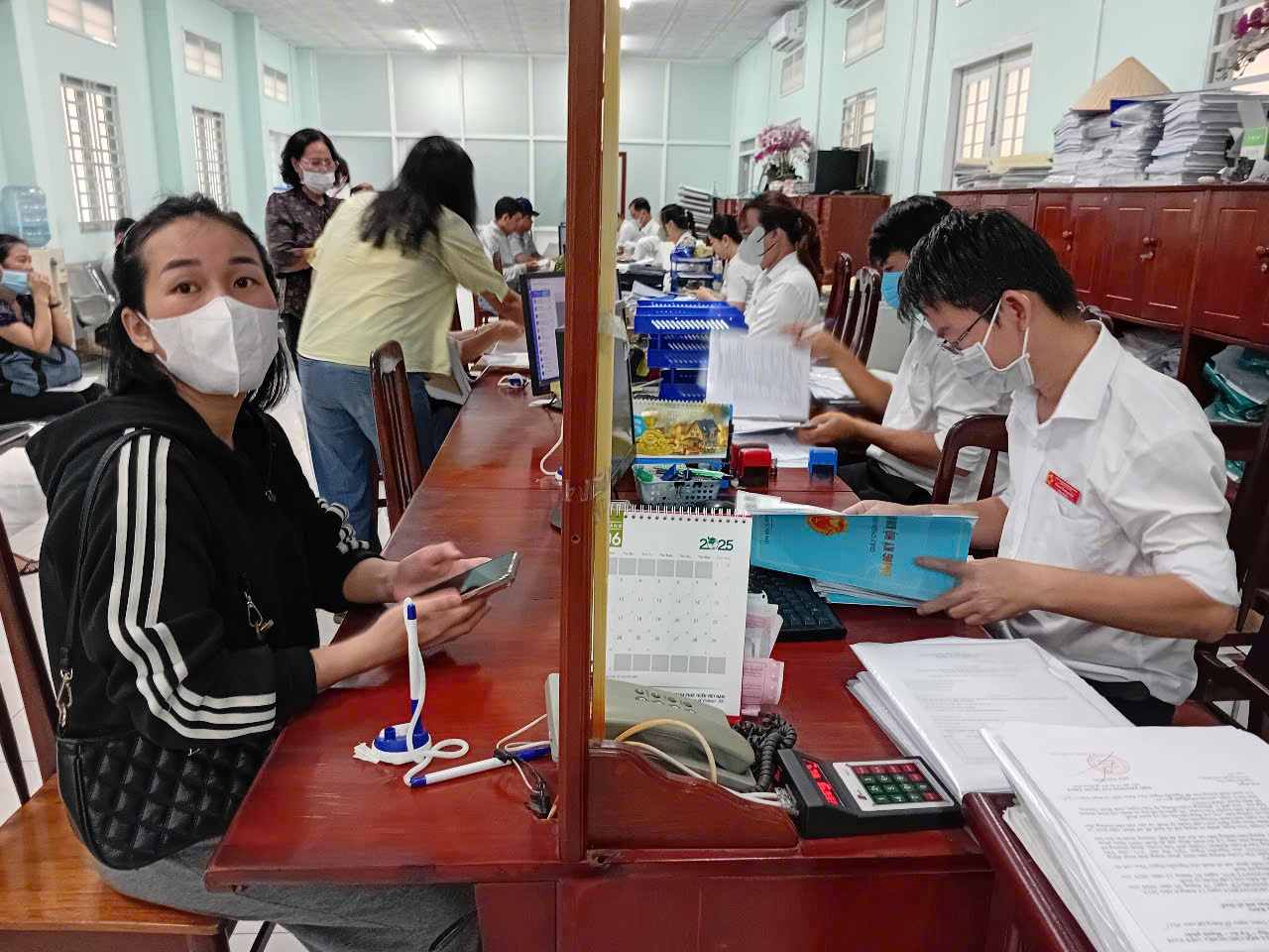 People go to handle administrative procedures. Photo: Dinh Trong