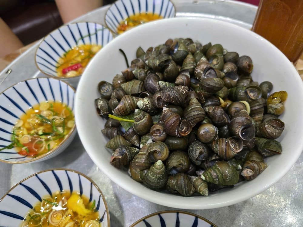Luộc ốc đúng cách sẽ giúp giữ được vị ngọt tươi, thơm ngon. Ảnh: Tuấn Đạt