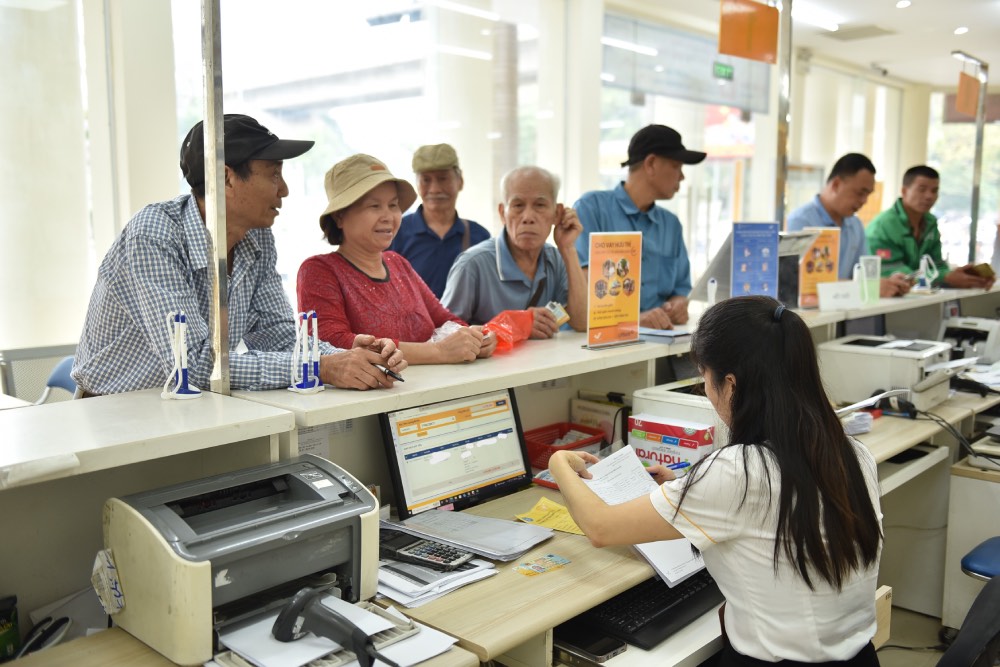 Hanoians receive pensions directly at the Post Office. Photo: Khanh Duy