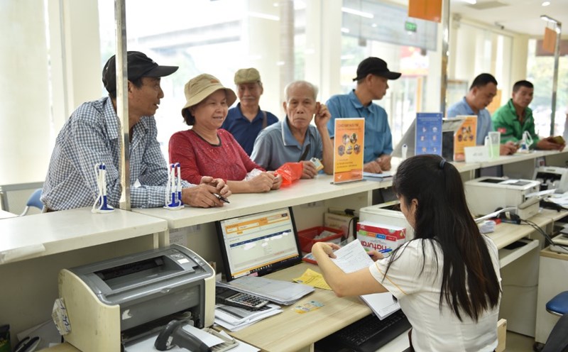 Hanoians receive pensions directly at the Post Office. Photo: Khanh Duy