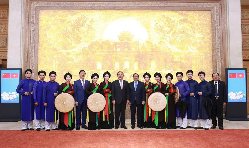 Thu tuong Pham Minh Chinh, Thu tuong Trung Quoc Ly Cuong va Bo truong Nguyen Van Hung cung voi cac lien anh, lien chi. Anh: DUONG GIANG