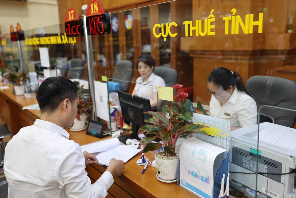 20 Los departamentos fiscales regionales se reorganizaran en 34 impuestos de provincias y ciudades. Foto: Hai Nguyen