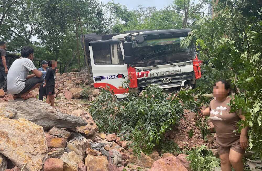 Scene of the accident of a Lao- sealed tractor-trailer on National Highway 12A.