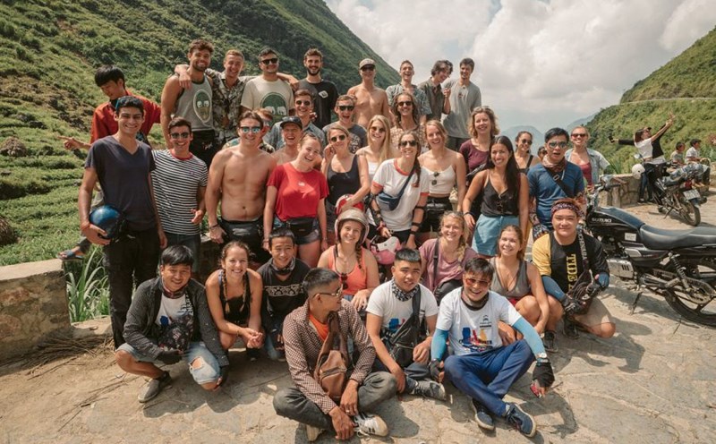 An international group took photos with local drivers in Ha Giang. Photo: Jasmine Ha Giang