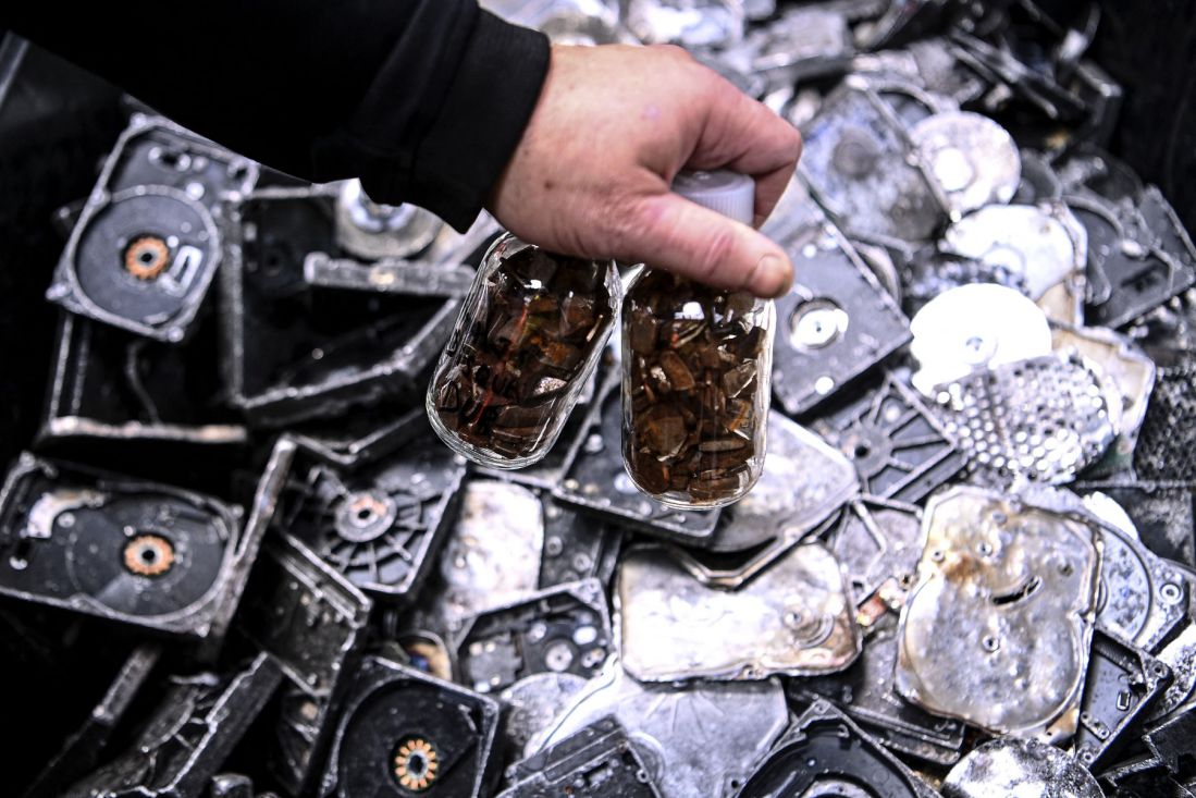 Minerals from magnet-filled containers contain rare earths after they are extracted and recycled from electronic waste in France. Photo: AFP