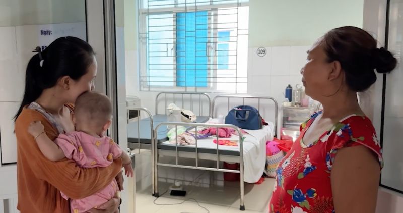 A family in Vinh Long chose to have a child for many reasons. Photo: Hoang Loc