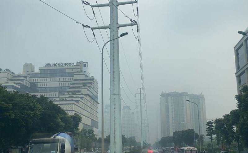 High-rise buildings are submerged in a layer of fine dust as fog in Hanoi. Photo taken on July 14. Photo: Thuy Linh