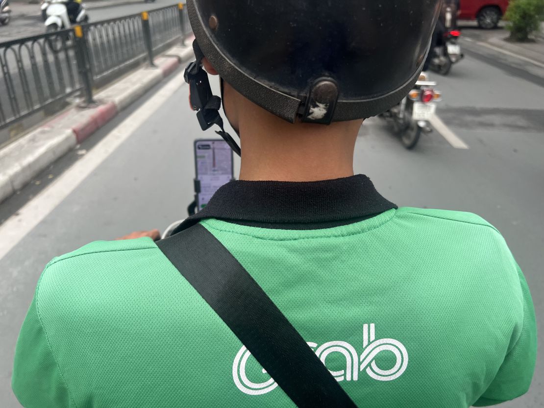 Grab drivers in the informal sector are looking for ways to adapt to new requirements. Photo: Kieu Vu