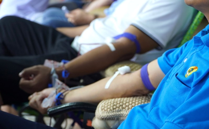 Union members and workers participate in blood donation.
