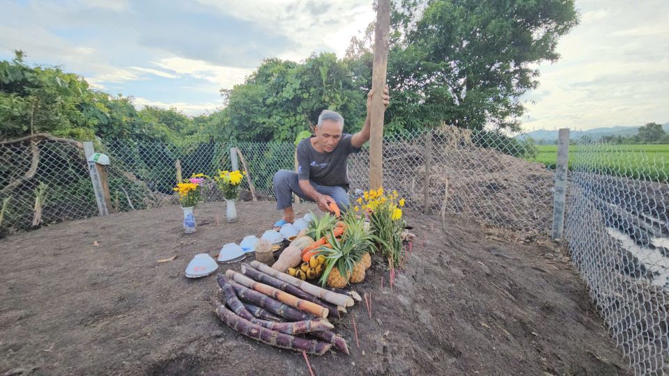 Ma Quoc next to the elephant grave of bak Kham. Photo: Thanh Quynh