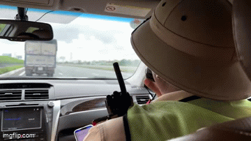 Traffic police drive specialized cars, speakers ask trucks to leave lane 1 on the highway