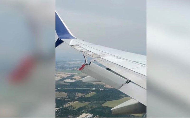 The wing of the plane broke while it was in the air. Photo cut from passenger video