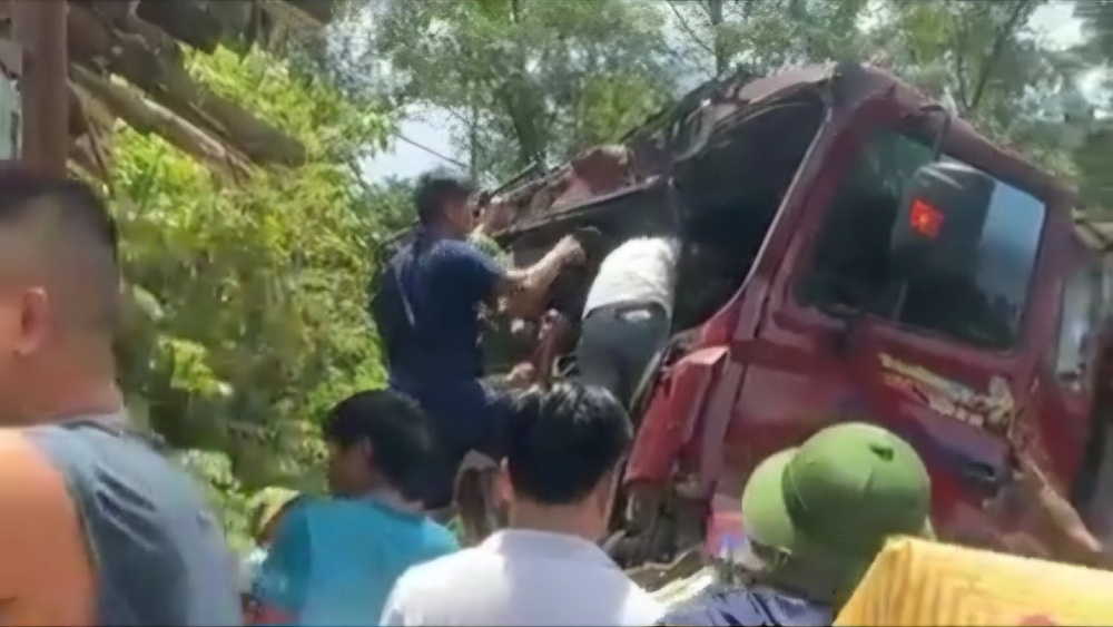 The front of the container truck was deformed after colliding with a truck on National Highway 12A.