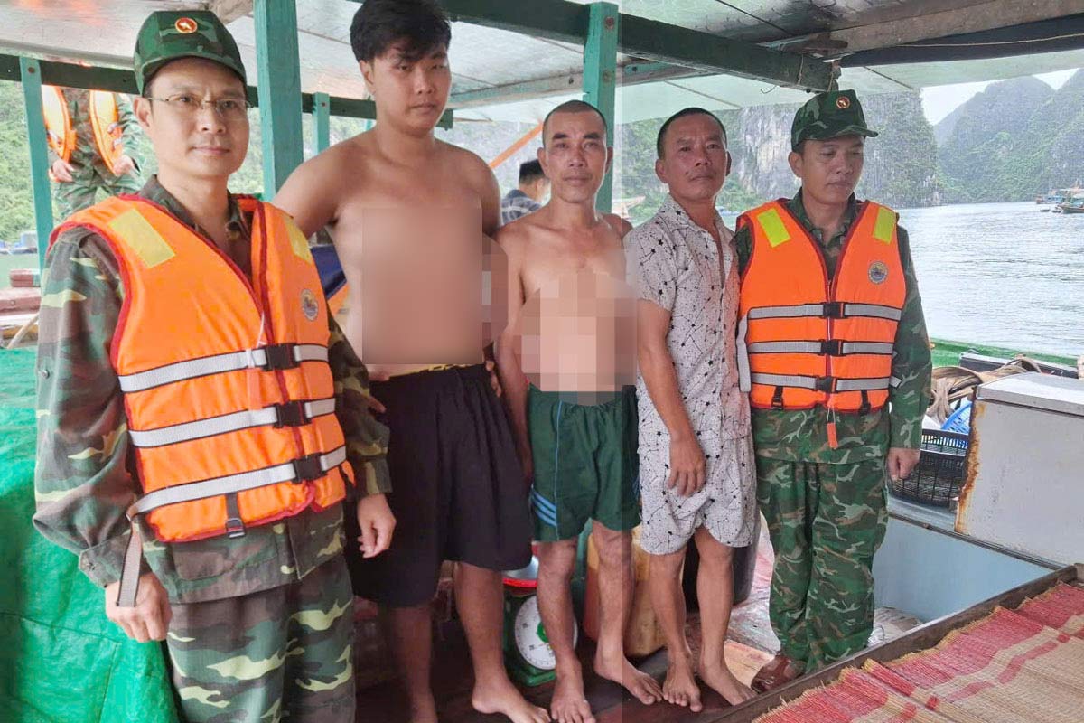 国境警備局の職員国境ゲートホンガイ港は、漁師が苦しんでいることを奨励しました。写真：Quang Ninh Border Guard