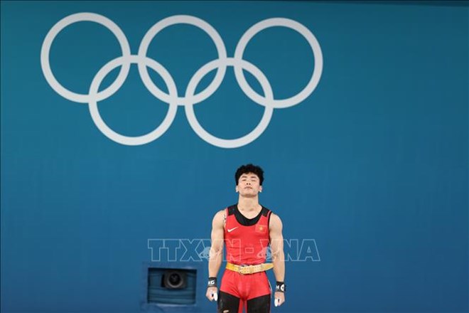 L'athlete Trinh Van Vinh a demenage a une competition de poids de 65 kg en 2025. Photo: VNA