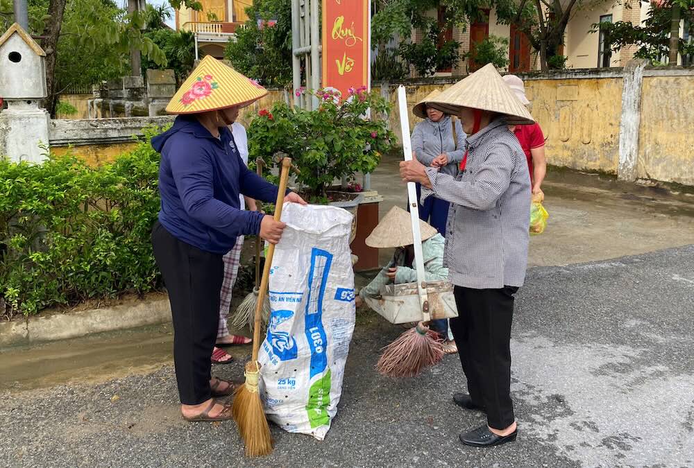 People in Quang Tri clean up and decorate the village road to celebrate National Day on September 2. Photo: Ngo Hien