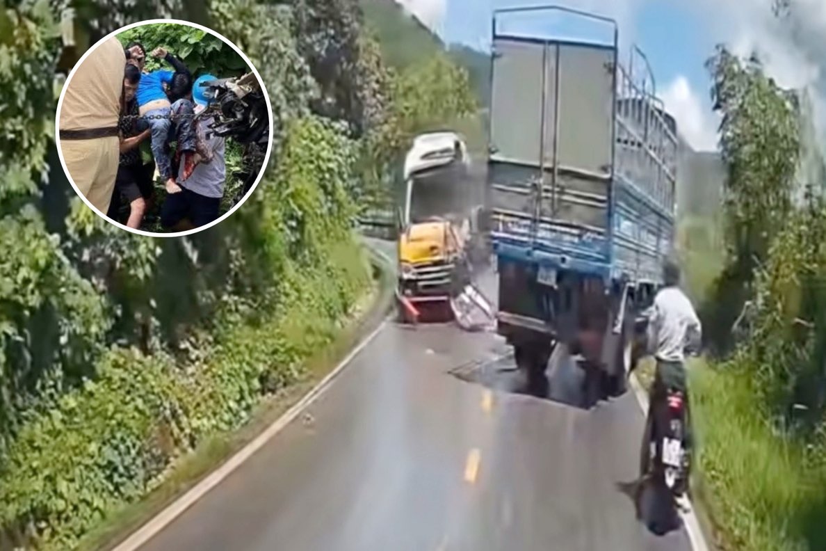 A passenger bus collided head-on with a truck on National Highway 3, causing a driver to have his foot crushed. Photo: Trong Bui