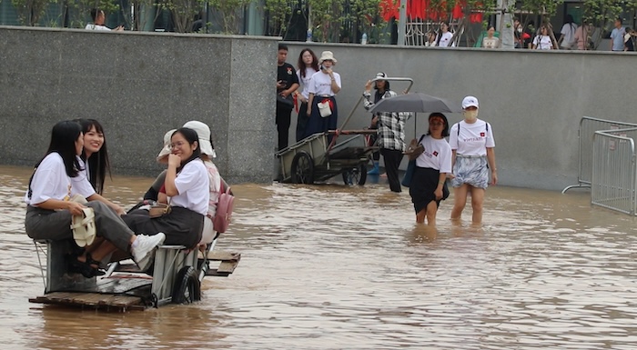 The road to the museum has become a river, and the tourist trailer service is booming.