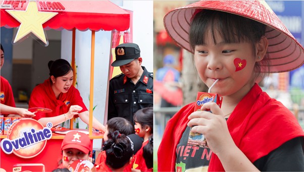 Hoat dong trao sua cua cac tinh nguyen vien Ovaltine da tiep suc cho cac em thieu nhi va nguoi dan trong khong khi cua ngay hoi. Anh: Ovaltine