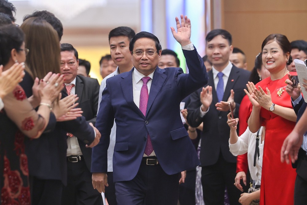 Politburo member and Prime Minister Pham Minh Chinh attended a meeting with the business community. Photo: VGP/Nhat Bac