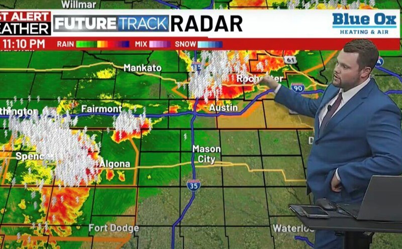 Weather MC Nick Jansen stopped to text his wife while hosting a live broadcast. Photo cut from KTTC video