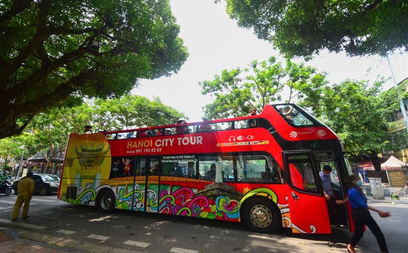 A double-decker bus carries tourists to Hanoi. Photo: Hai Nguyen