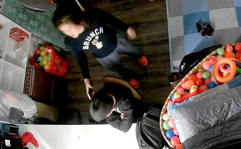 Video shows the scene where a boy is allegedly beaten on the head by his stepmother with a phone. Photo: S.Lam