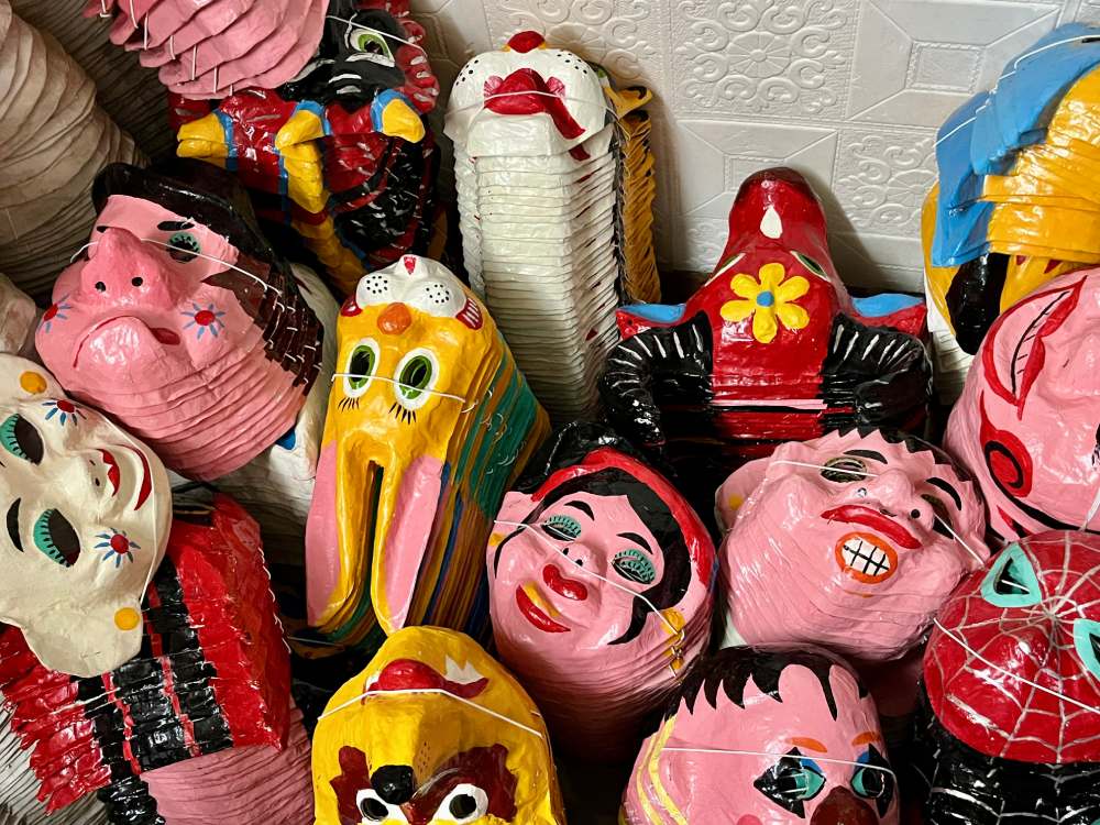 The colorful reed paper masks are handcrafted by the artisans Nguyen Van Hoa and Dang Huong Lan. Photo: Quynh Mai