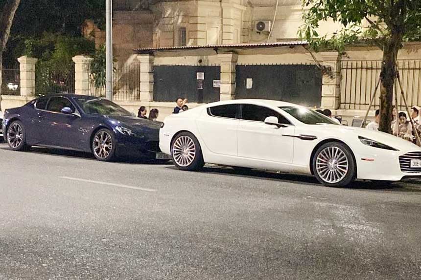 Maserati Gran Turismo and Aston Martin Rapide appeared together on the streets of Hanoi. Photo: Minh Duc