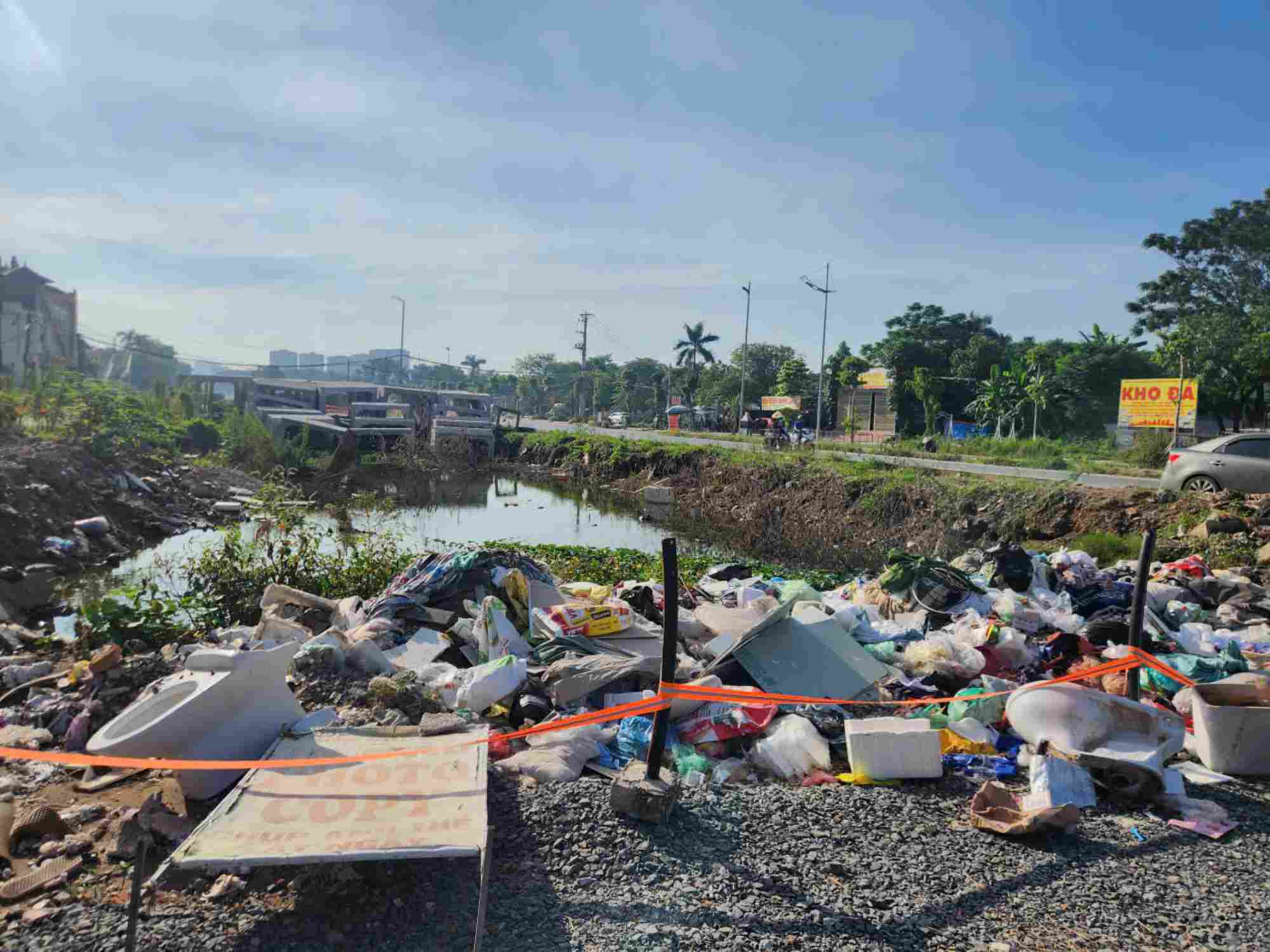 Unfinished construction creates a place to dump waste causing pollution. Photo: Minh Hanh