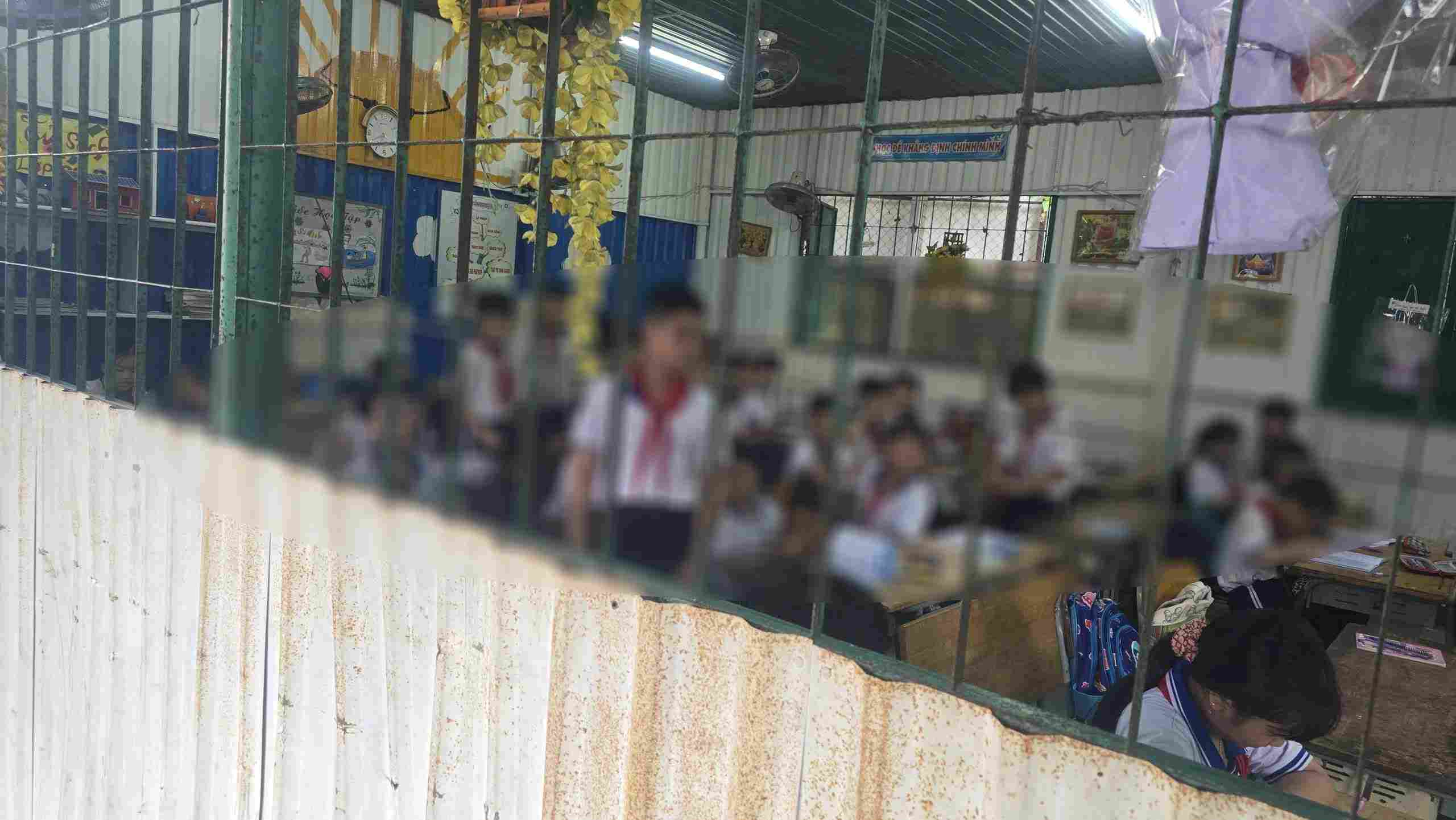 Students of a school in Ho Chi Minh City have to study in corrugated iron classes. Photo: Duong Binh