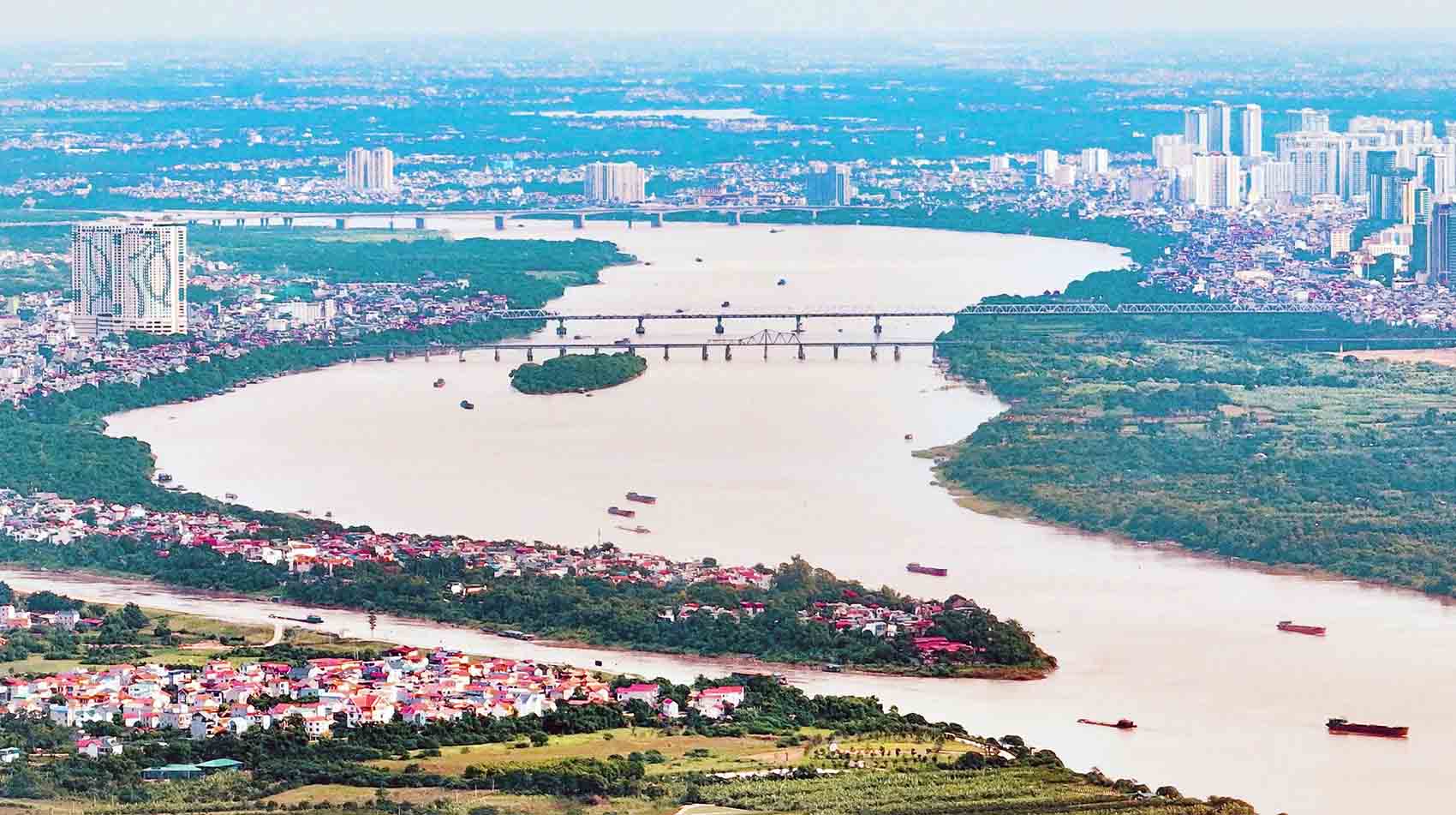 Hanoi est sur le point de commencer la construction de Thuong Cat Bridge a travers la riviere Rouge. Photo: vague