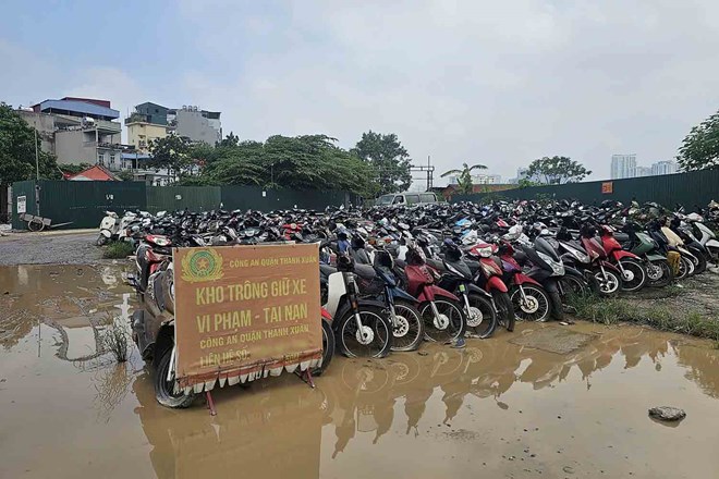 違反・事故車両駐車場は、2025年7月のThanh Liet phuong(ハノイ)地域にあります。写真:Song Huu