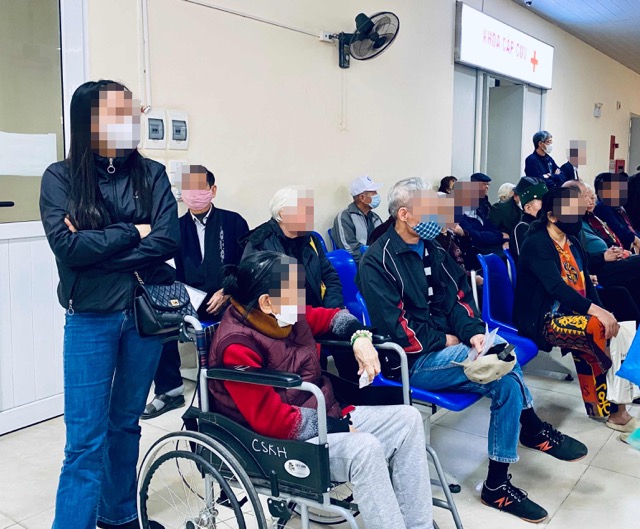 People waiting for health insurance examination. Photo: Thuy Linh