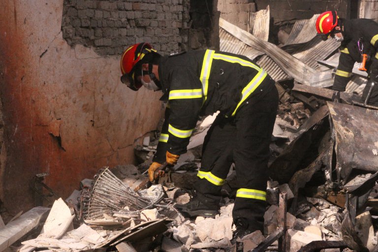 South Korean firefighters working at the scene of a fire. Photo: AFP