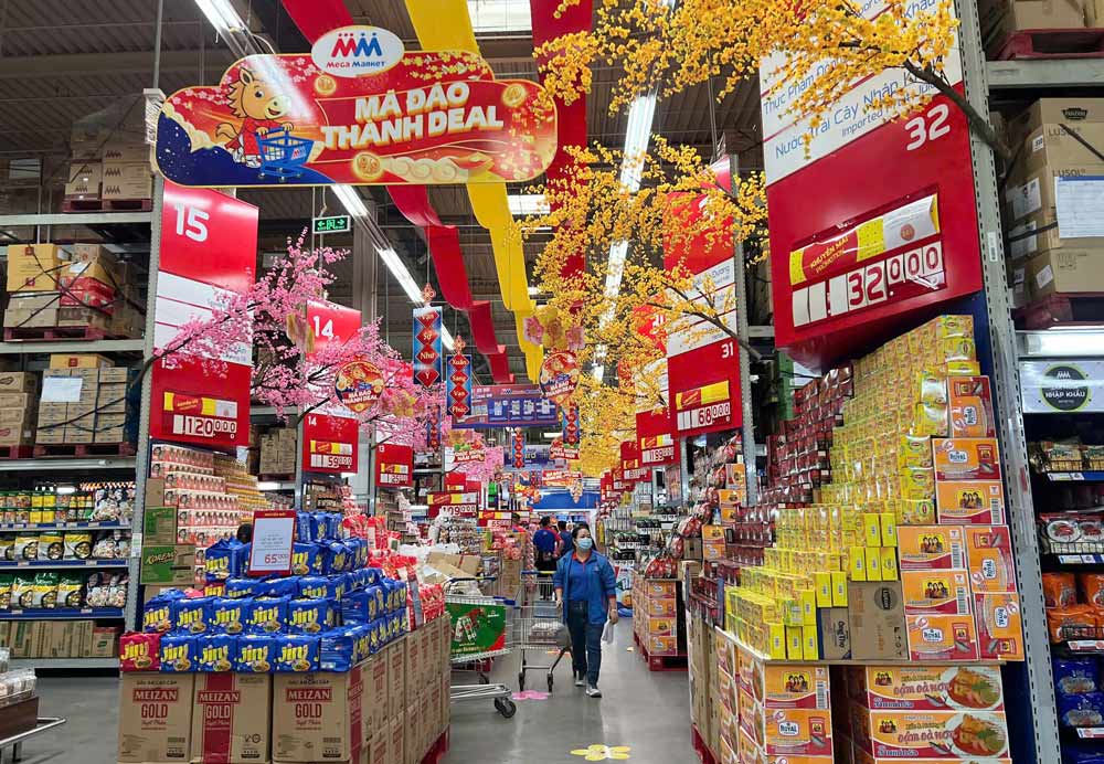 MMメガマーケットベトナムは、2025年のテト(旧正月)と比較して、テト・ビン・ゴ(旧正月)向けの供給と在庫量を10〜30%増やし、同時に食品安全管理ソリューションを展開しています。写真:DN提供