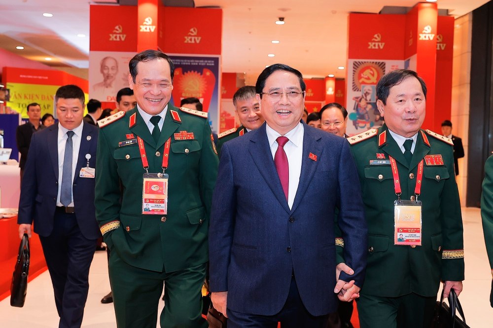 Politburo member, Prime Minister Pham Minh Chinh and delegates attend the third official working day of the 14th Party Congress. Photo: VNA
