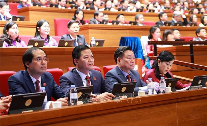 Seance de discussion en salle sur les documents du XIVe Congres du Parti, dans l'apres-midi du 21 janvier. Photo: TTXVN