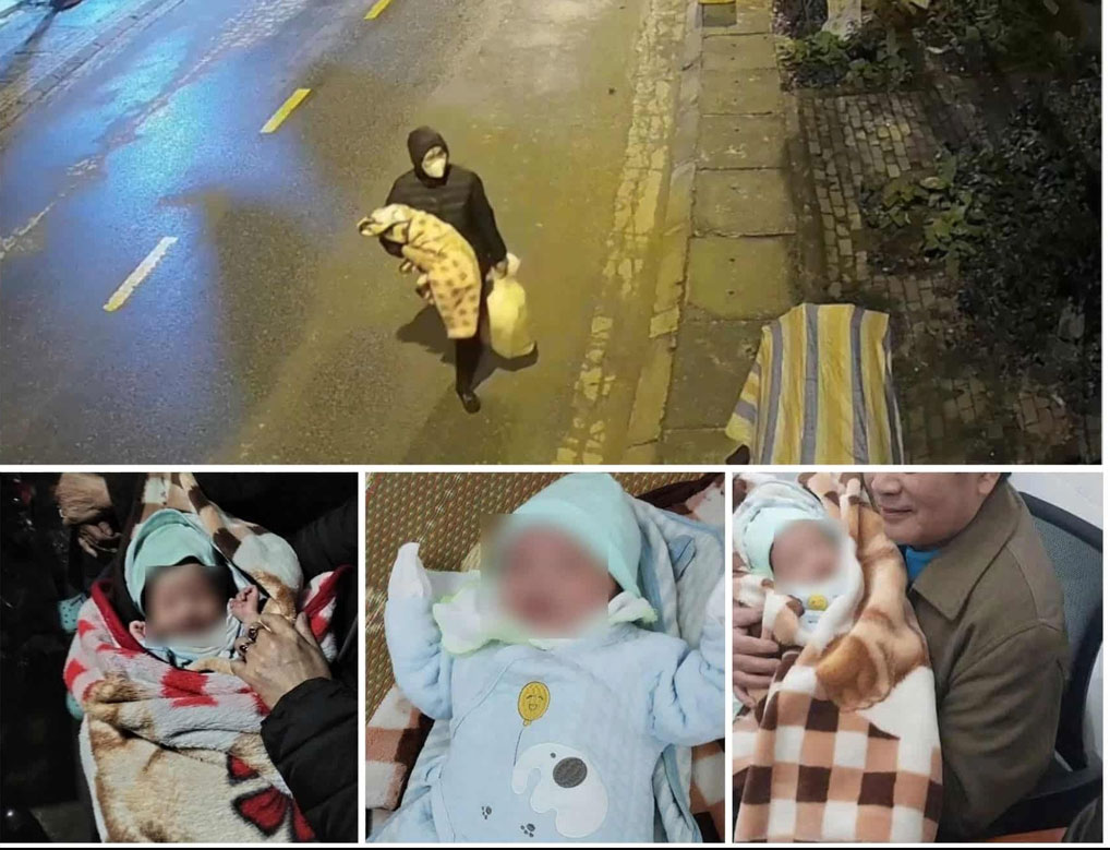 Image of a woman carrying a newborn baby girl on Tran Phu street in the early morning of January 23. Photo cut from clip.