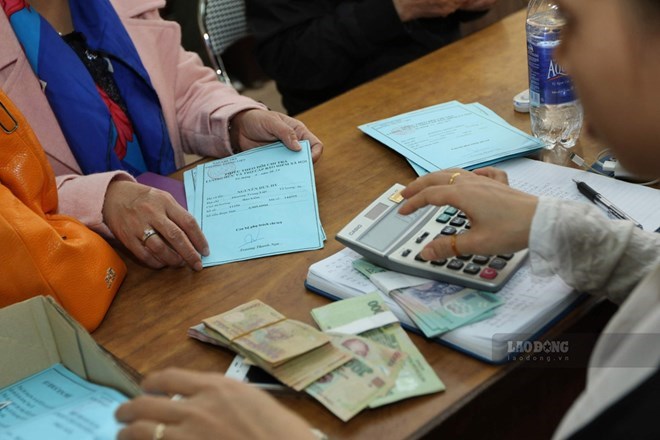 Schedule of combined payment of pensions, social insurance allowances for February-March and Tet gifts. Photo: Hai Nguyen