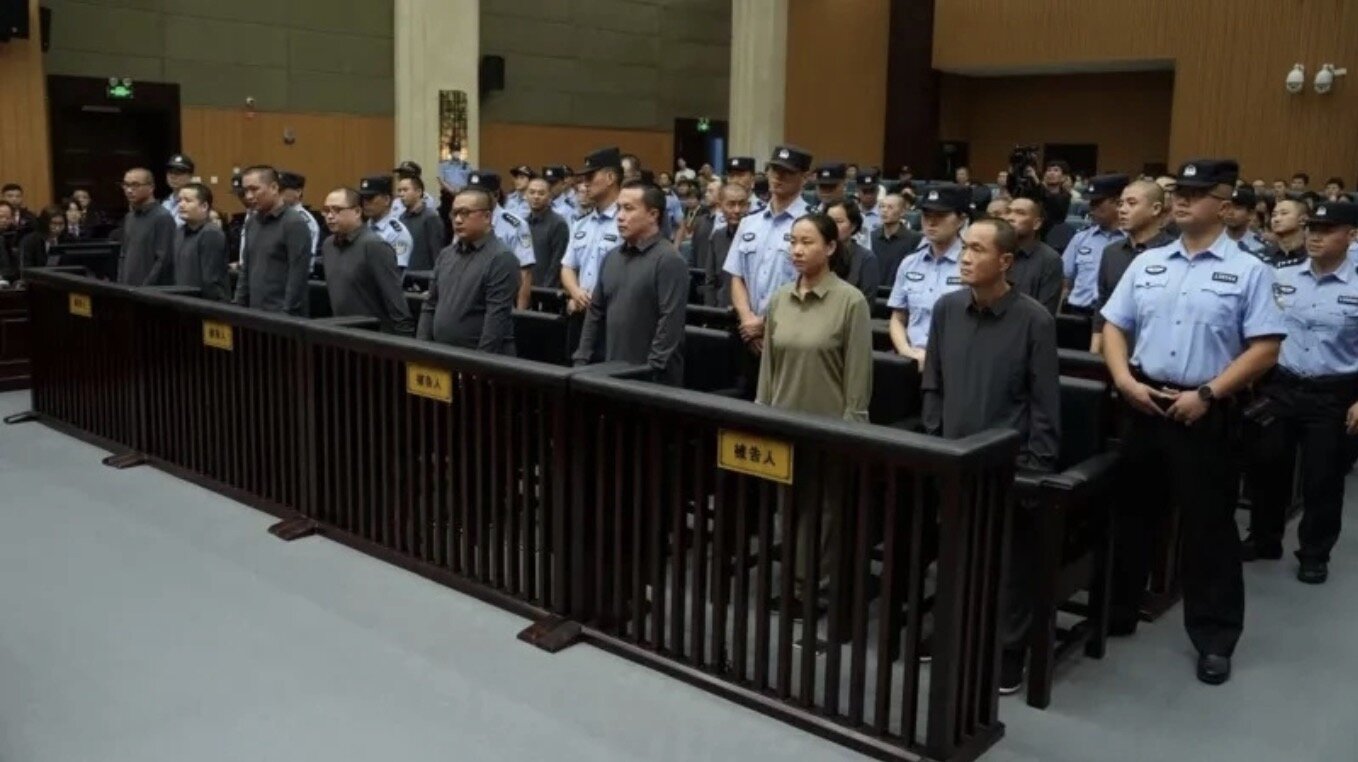 Minh family gang members at a court hearing in China in November 2025. Photo: CCTV