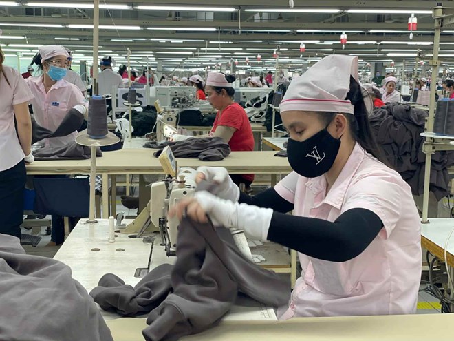 Điều 33 Nghị định số 338/2025/NĐ-CP của Chính phủ nêu kinh phí hỗ trợ người lao động đi làm việc ở nước ngoài theo hợp đồng. Ảnh: Đình Trọng

