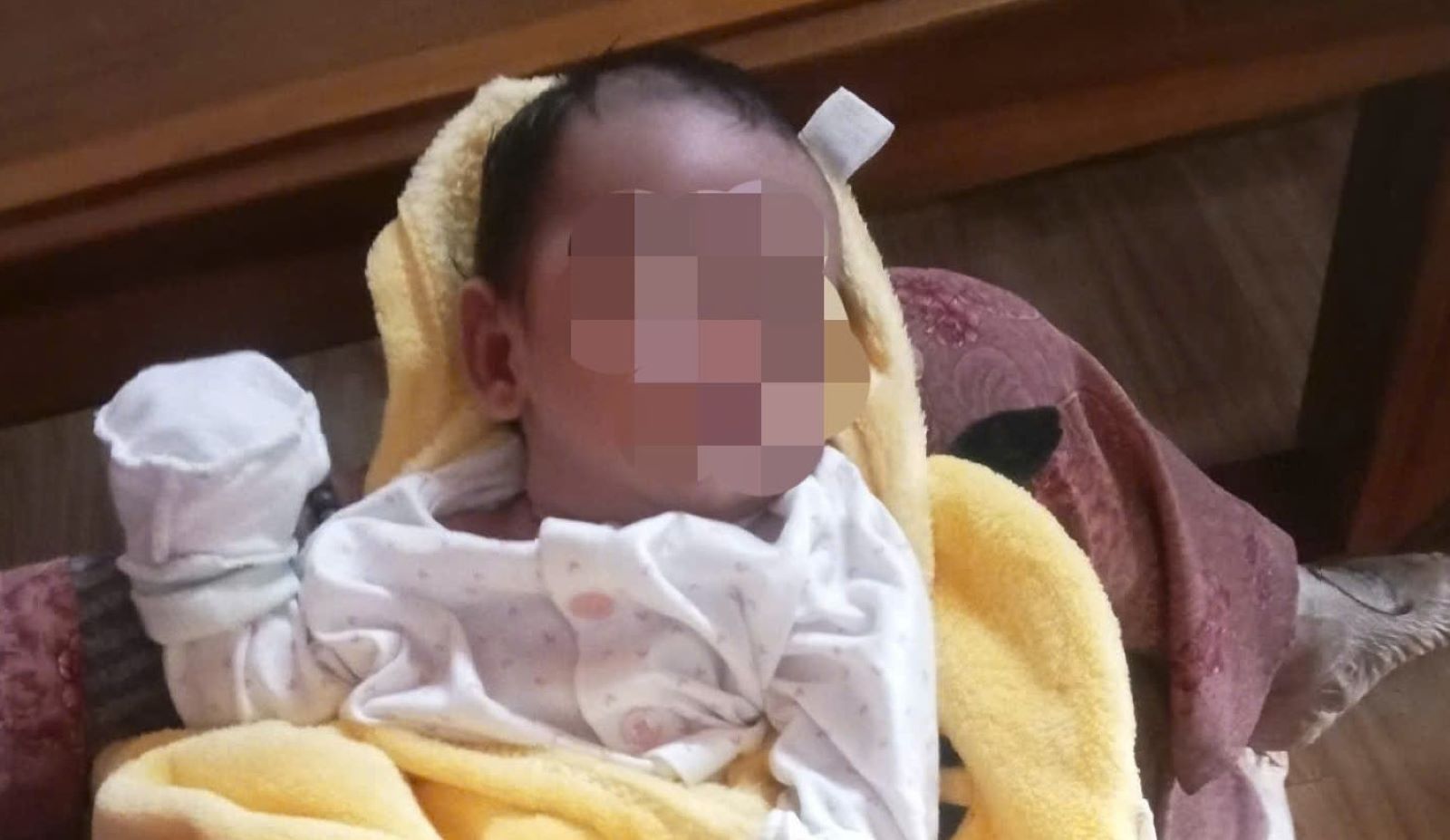 Abandoned baby boy is being temporarily cared for by households. Photo: H.Nguyen