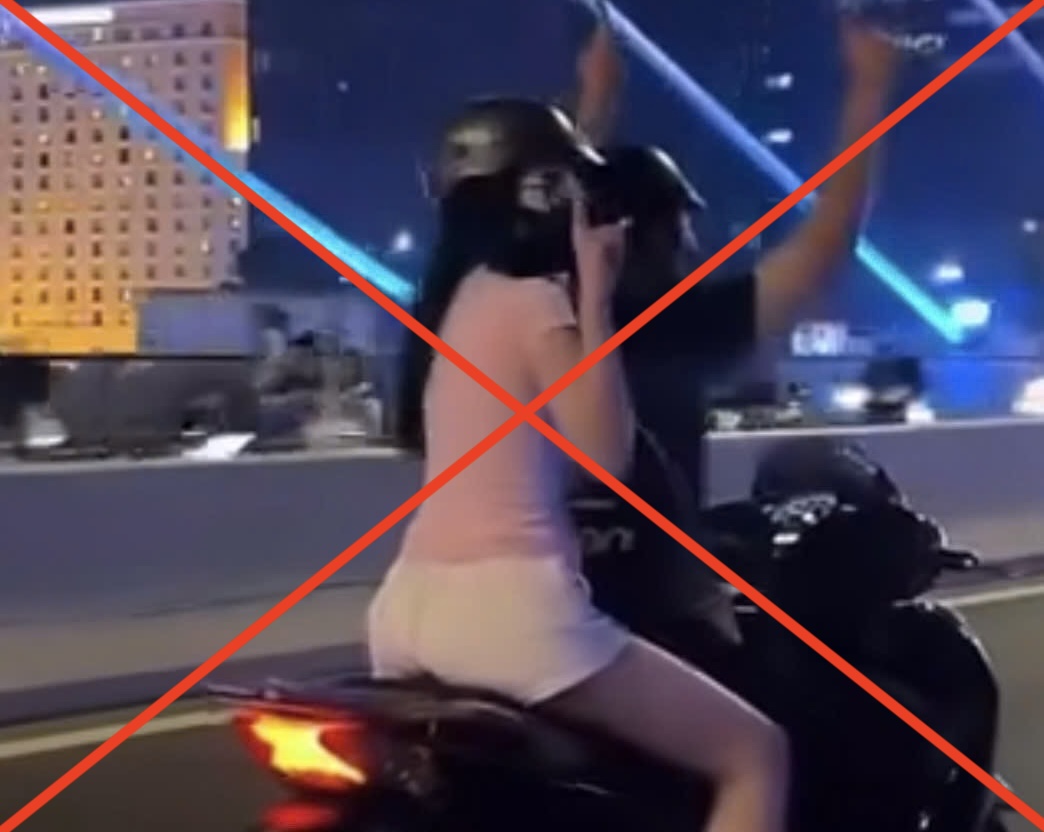 Nam thanh niên buông hai tay khi đang lái xe trên cầu Ba Son bị tịch thu phương tiện. Ảnh: Cắt từ clip