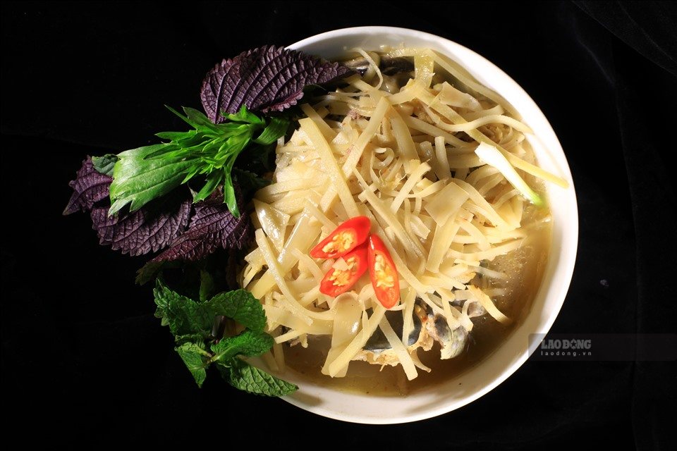 Warm meal from stream fish, sour bamboo shoots