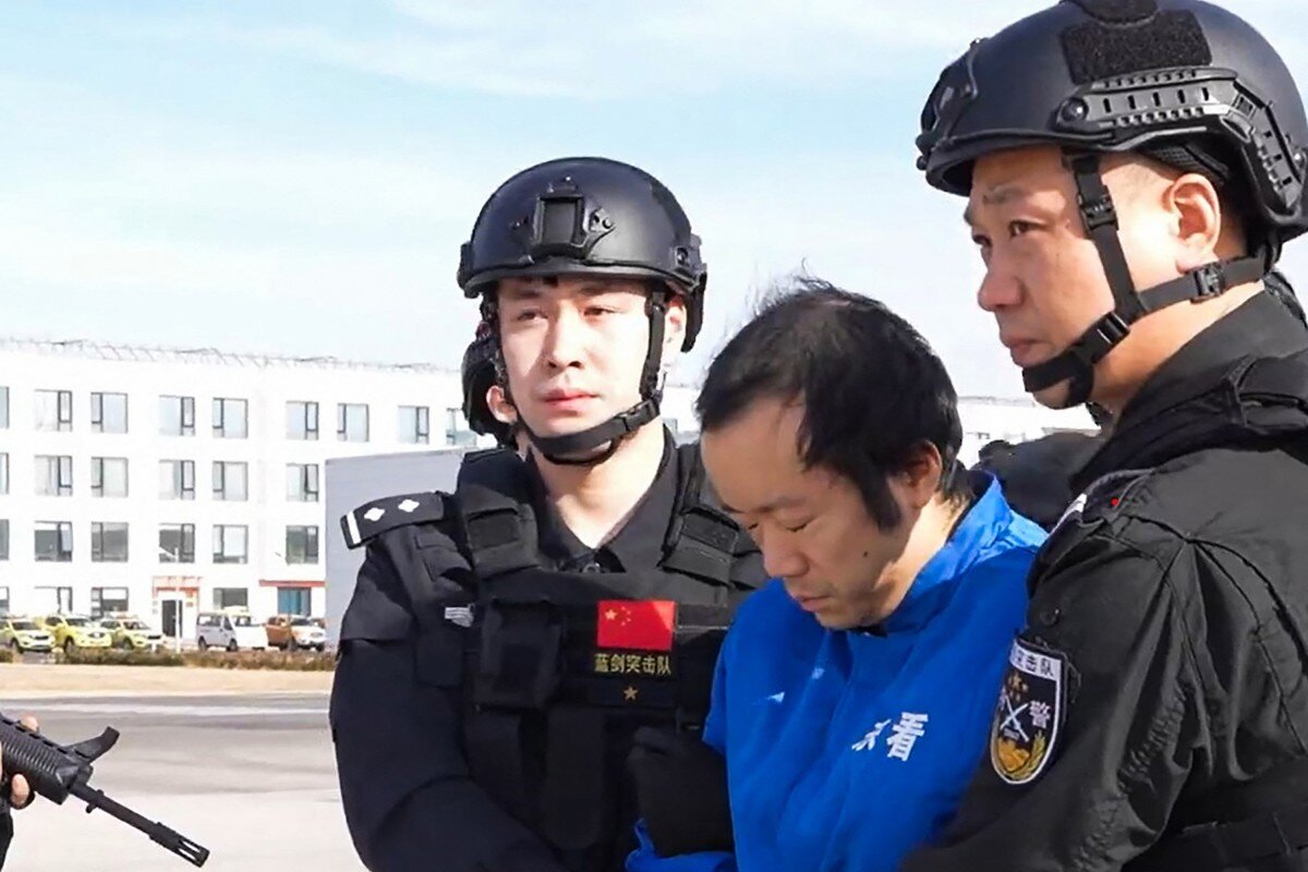 Fraud boss Chen Zhi when extradited to China. Photo: Xinhua